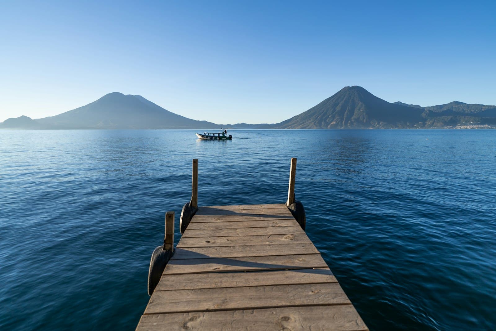 Lake Atitlán with volcanoes in the background